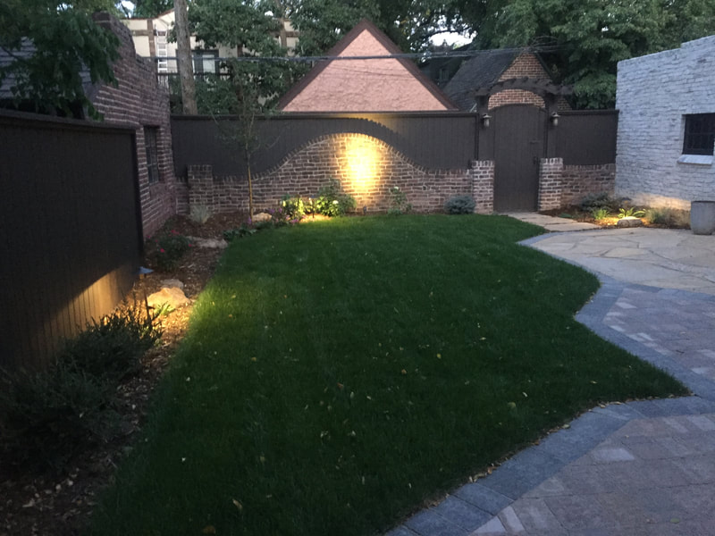 Outdoor spot light features increase safety and showcase plantings for a home landscape in Denver's Cherry Creek neighborhood. 