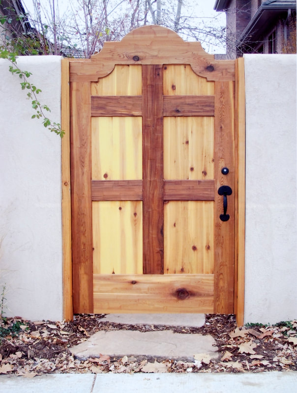 Picture of a custom designed pine wood fence gate. 