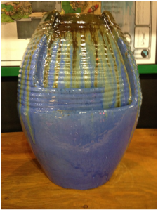 Picture of an indoor table top jar fountain with pottery finish. 